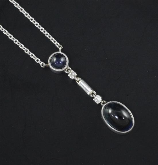 A white gold, cabochon sapphire and diamond set drop pendant necklace, pendant 1.25in.